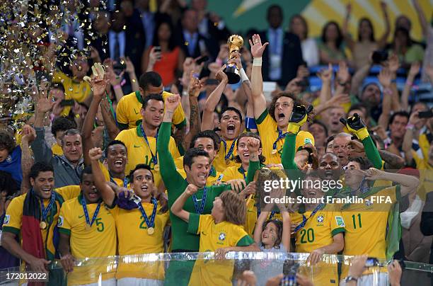 Thiago Silva of Brazil lifts the trophy with his team-mates following their victory at the end of the FIFA Confederations Cup Brazil 2013 Final match...