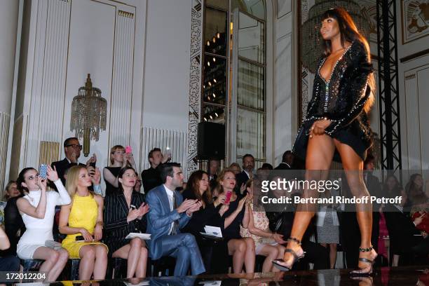 Actors Emma Roberts, Mena Suvari, Delphine Chaneac, Zachary Quinto, Guest, Thurman, Jo Levin and David Furnish watching model Naomi Campbell on the...