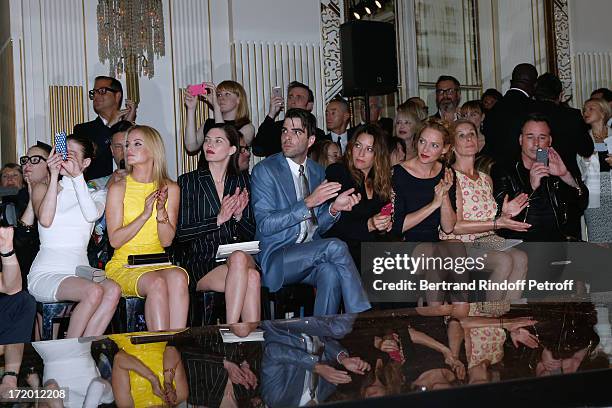 Actors Emma Roberts, Mena Suvari, Delphine Chaneac, Zachary Quinto, Guest, Thurman, Jo Levin and David Furnish attend the Versace show as part of...
