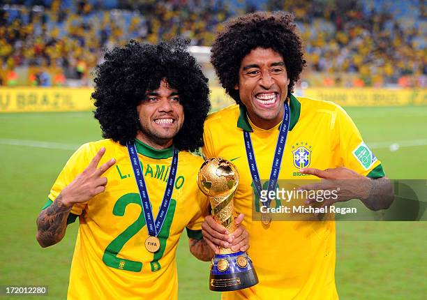 Daniel Alves celebrates with team-mate Dante of Brazil at the end of the FIFA Confederations Cup Brazil 2013 Final match between Brazil and Spain at...
