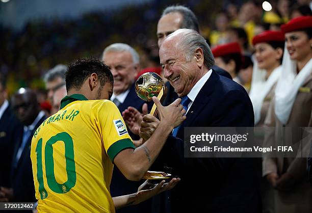 President Sepp Blatter presents Neymar of Brazil with the adidas Golden Ball Award at the end of the FIFA Confederations Cup Brazil 2013 Final match...