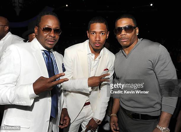 Singer Bobby Brown, TV personality Nick Cannon and rapper Nelly onstage during the 2013 BET Awards at Nokia Theatre L.A. Live on June 30, 2013 in Los...