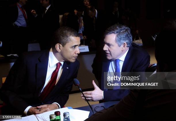 President Barack Obama and British Prime Minister Gordon Brown talk at the start of a round table meeting in London on April 2, 2009 during the G20...