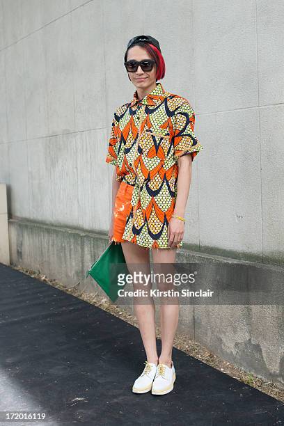 Chief fashion editor of Men's Health China Boynam wears a Marc Jacobs hat, Koops sunglasses, Vintage Kenzo shirt, Levi's shorts, Givenchy clutch and...