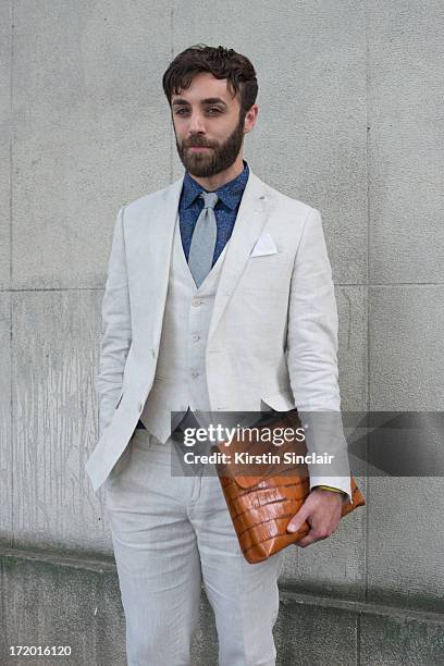 Fashion Editor at Fashionising Daniel Dykes wears a Daniella Lehai bag, Zara suit, J Crew tie and a Uniqlo shirt on day 4 of Paris Collections: Men...