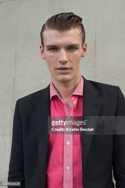 Model Tomek Szalanski wears an H and M shirt and an Acne jacket on day 4 of Paris Collections: Men on June 29, 2013 in Paris, France.