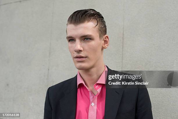 Model Tomek Szalanski wears an H and M shirt and an Acne jacket on day 4 of Paris Collections: Men on June 29, 2013 in Paris, France.