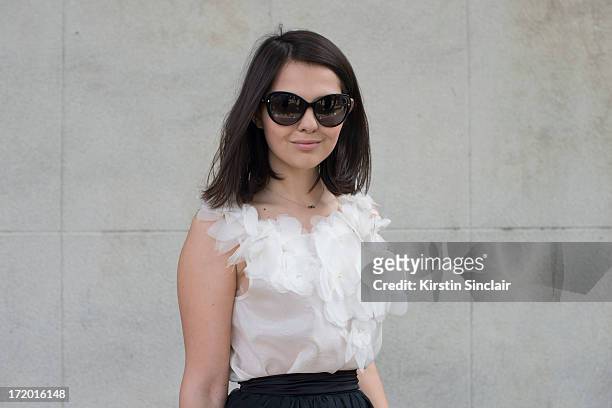 Fashion Blogger Doina Ciobanu wears a Rhea Costa skirt and top and Dior sunglasses on day 4 of Paris Collections: Men on June 29, 2013 in Paris,...