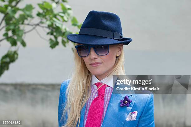 Fashion Editor for the Rake Sarah Ann Murray wears Italia Independent sunglasses, a Bespoke Q menswear suit and shirt, Bates hat, Marinella tie, Dior...