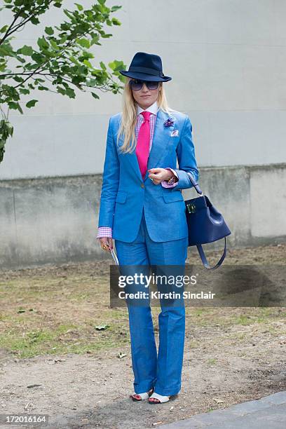 Fashion Editor for the Rake Sarah Ann Murray wears Italia Independent sunglasses, a Bespoke Q menswear suit and shirt, Bates hat, Zara shoes,...