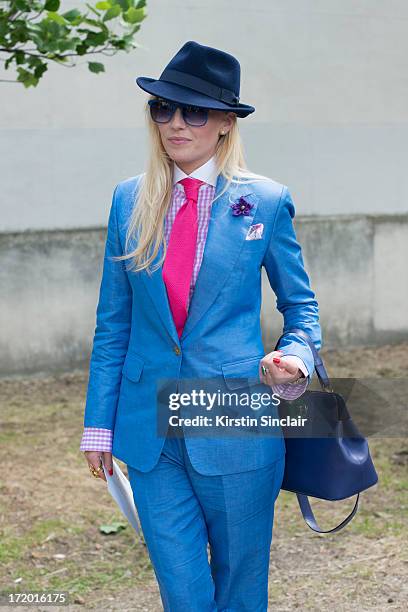 Fashion Editor for the Rake Sarah Ann Murray wears Italia Independent sunglasses, a Bespoke Q menswear suit and shirt, Bates hat, Marinella tie, Dior...