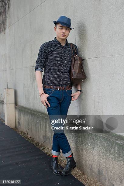 Yong Hao Yu wears sean White shoes, Zara jeans and hat, Tom Lee shirt and an Asos bag on day 4 of Paris Collections: Men on June 29, 2013 in Paris,...