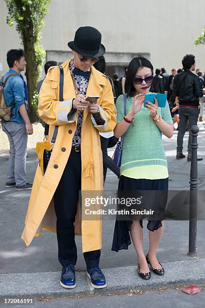 And Fashion blogger Peter Xu and guest on day 4 of Paris Collections: Men on June 29, 2013 in Paris, France.