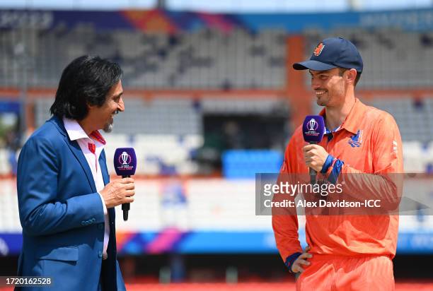 Scott Edwards of Netherlands speaks with commentator Ramiz Raja following the coin toss prior to the ICC Men's Cricket World Cup India 2023 between...