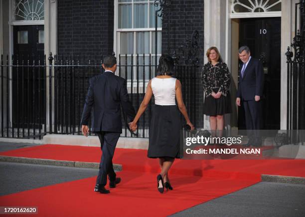 President Barack Obama and his wife Michelle Obama are greeted by British Prime Minister Gordon Brown and his wife Sarah upon arrival at 10 Downing...