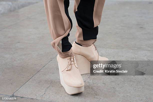 Model Emiley Ratajkowski wears Chloe trousers and Etscallatay shoes on day 3 of Paris Collections: Men on June 28, 2013 in Paris, France.