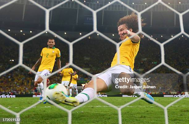 David Luiz of Brazil makes a goal line clearance during the FIFA Confederations Cup Brazil 2013 Final match between Brazil and Spain at Maracana on...