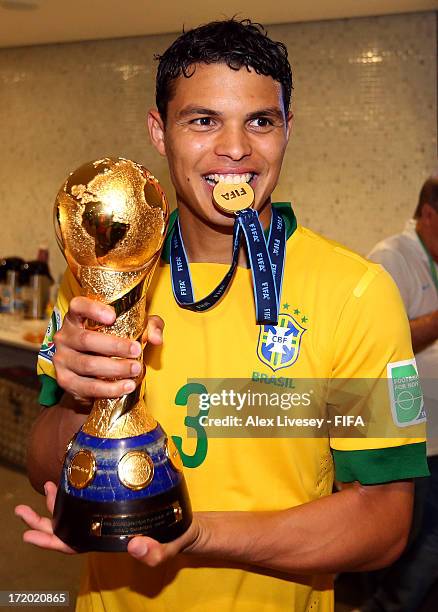 Thiago Silva of Brazil poses with his medal and the trophy after the FIFA Confederations Cup Brazil 2013 Final match between Brazil and Spain at...