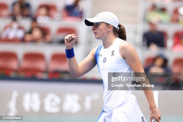 Iga Swiatek of Poland competes in her quarterfinal match against Caroline Garcia of France during day 11 of the 2023 China Open at National Tennis...