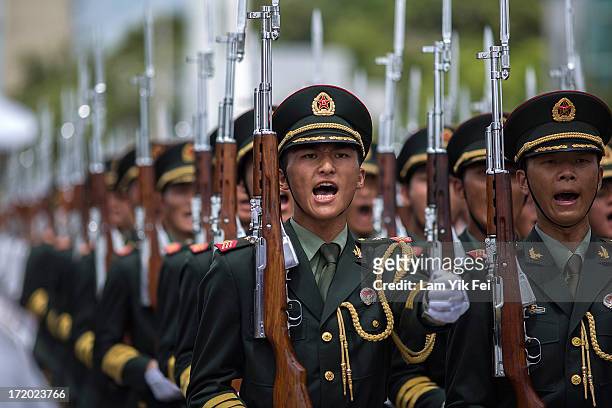 China's Peoples' Liberation Army soldiers march during the Hong Kong Special Administrative Region Establishment Day holiday open day at the Ngong...