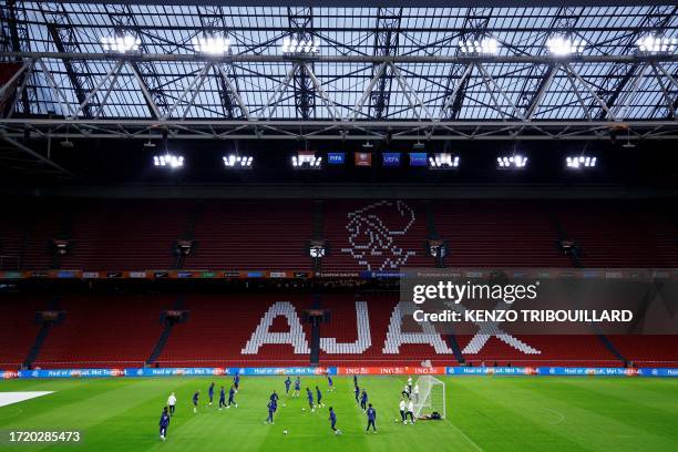 France's players take part in a training session at the Johan Cruijff stadium, in Amsterdam on October 12 on the eve of their UEFA Euro 2024 group B...