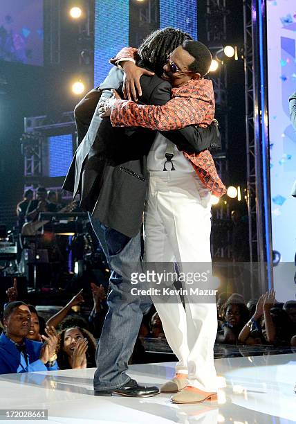 Recording Artists Snoop Lion and Charlie Wilson onstage during the 2013 BET Awards at Nokia Theatre L.A. Live on June 30, 2013 in Los Angeles,...