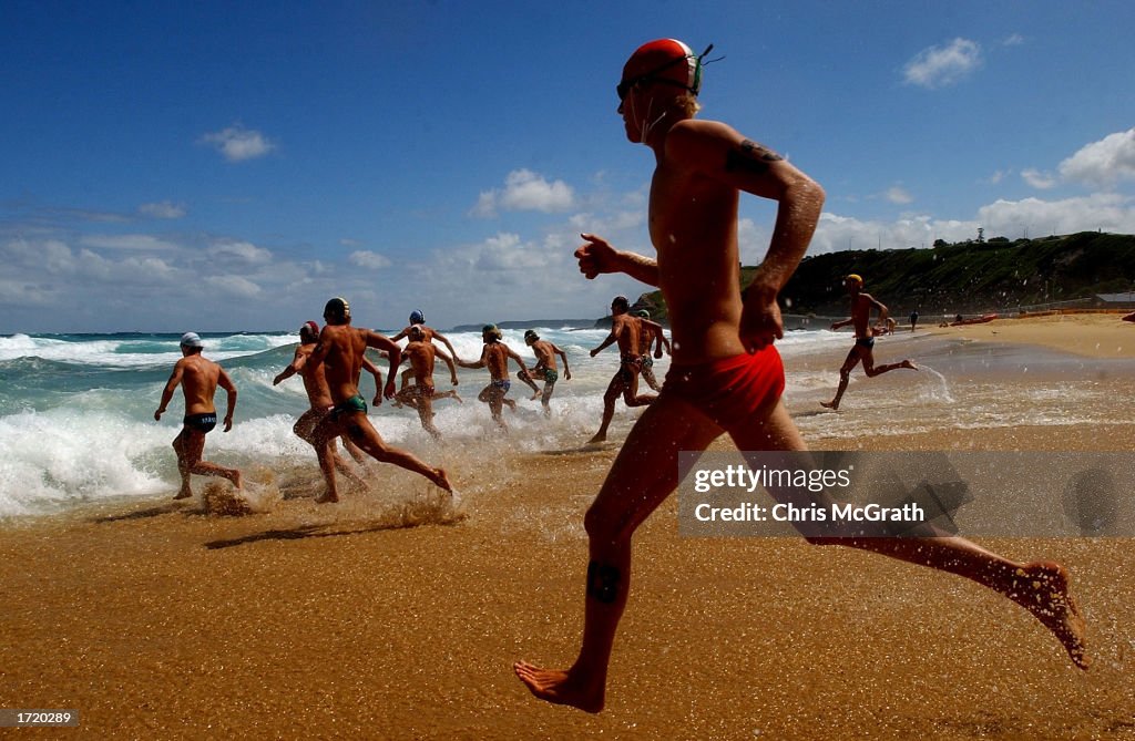 Competitors enter the water for the start