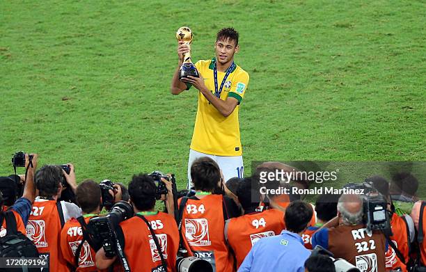 Neymar of Brazil celebrates with trophy after victory in the FIFA Confederations Cup Brazil 2013 Final match between Brazil and Spain at Maracana on...