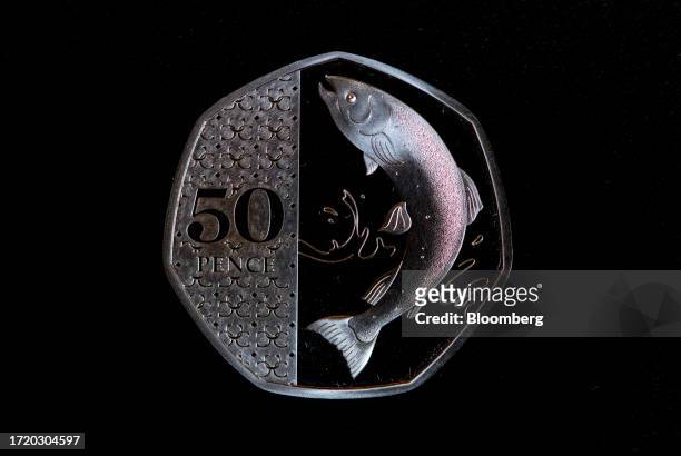 The reverse face of a 50-pence coin, featuring a design of an Atlantic salmon, displayed by the Royal Mint in London, UK, on Thursday, Oct. 12, 2023....