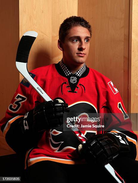 Morgan Klimchuk poses for a portrait after being selected number twenty eight overall in the first round by the Calgary Flames during the 2013 NHL...