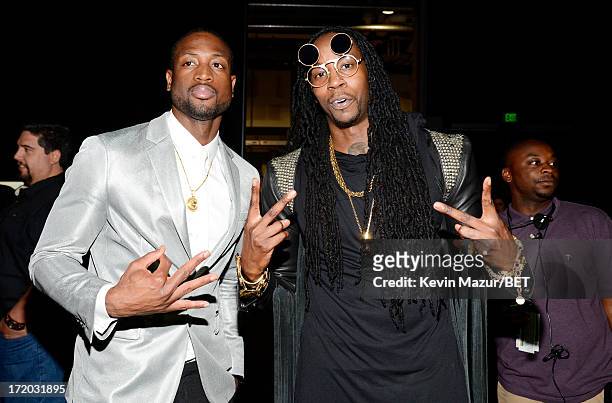 NBA Player And A Singer Pose Together For A Photo. The Height