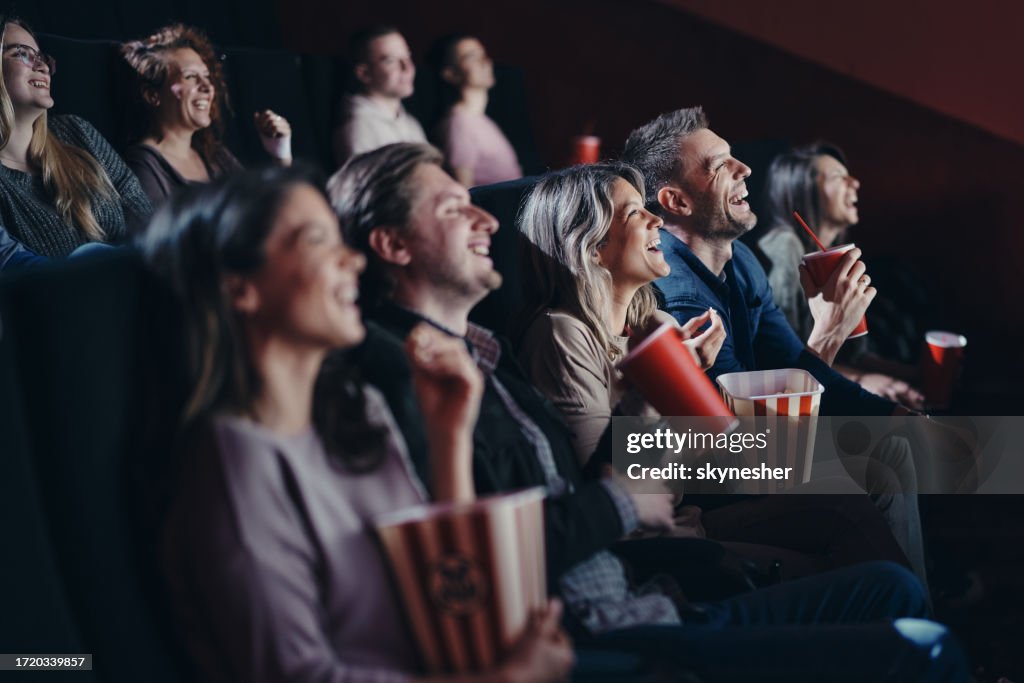 Happy Viewing Happy Couple Having Fun During A Movie Screening In Cinema High-Res ...