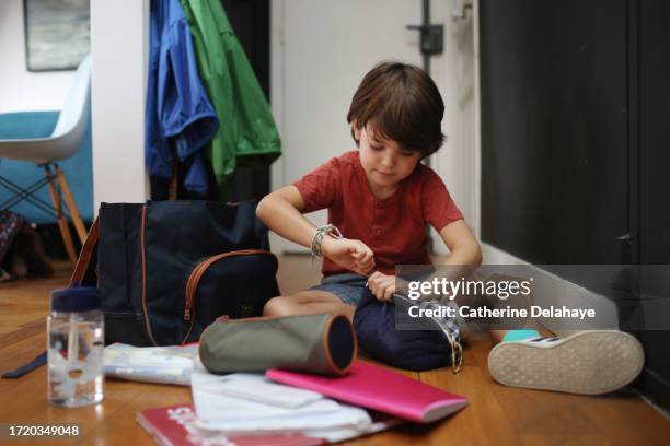 a 6 year old boy preparing to go to school - one boy only stock pictures, royalty-free photos & images