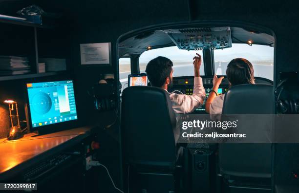 student pilots learning to fly aeroplain - pilot simulator stock pictures, royalty-free photos & images