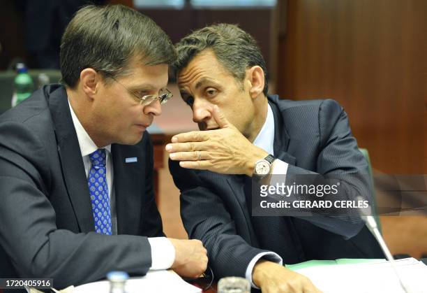 French President Nicolas Sarkozy talks with Dutch Prime Minister Jan Peter Balkenende prior to a working session on the second day of an EU summit at...