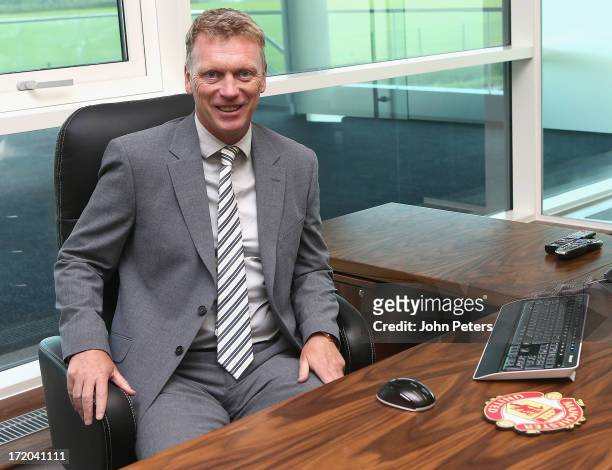 David Moyes of Manchester United, arrives for his first day of work as the club's new manager at Carrington Training Ground on July 1, 2013 in...