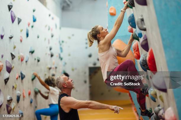 try this footing - climbing stock pictures, royalty-free photos & images