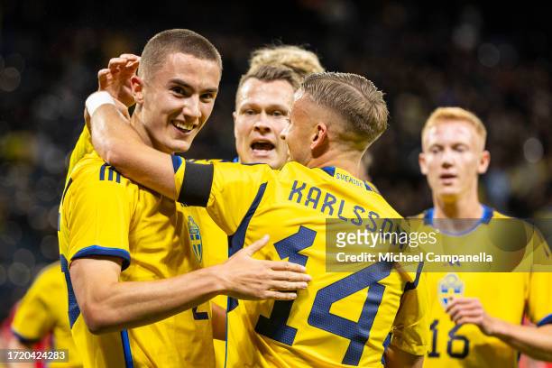 Sweden's Gustaf Lagerbielke celebrates with Viktor Claesson and Jesper Karlsson after scoring the 2-0 goal during the international friendly match...