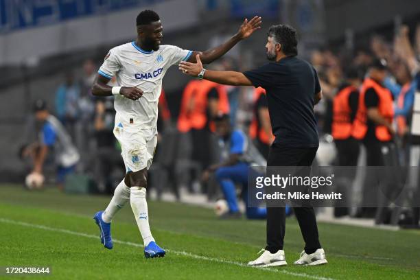 Chancel Mbemba of Marseille celebrates with Marseille coach Gennaro Gattuso after opening the scoring during the UEFA Europa League 2023/24 Group B...