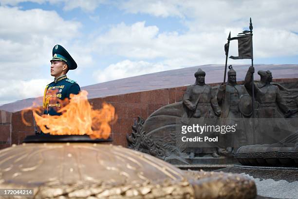 Soldier stands guard ahead of a wreath-laying ceremony by British Prime Minister David Cameron at the Monument of the Motherland Defenders on July 1,...