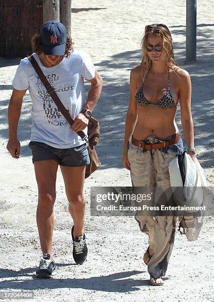 Barcelona football player Carles Puyol and his girlfriend, model Vanessa Lorenzo, are seen on June 29, 2013 in Ibiza, Spain.