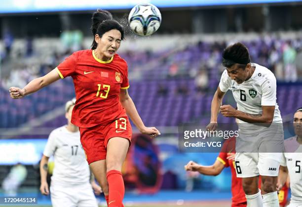 Yang Lina of Team China heads the ball in the Football - Women's Bronze Medal Match between China and Uzbekistan on day 13 of the 19th Asian Games at...