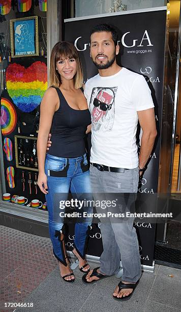 Football player Ezequiel Garay and her wife Tamara Gorro attend the opening of their second clothes shop 'Go' on June 28, 2013 in Madrid, Spain.