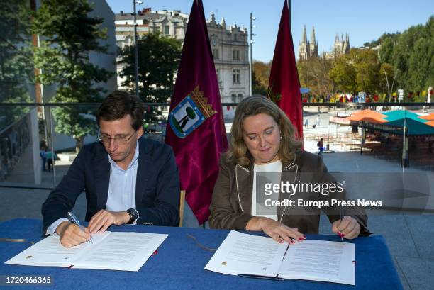 The Mayor of Madrid, Jose Luis Martinez-Almeida, and the Mayoress of Burgos, Cristina Ayala, sign an agreement during a meeting at the Forum...