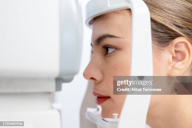 having routine eye check-ups is a better visual function, preventing damage, and sight loss. close-up of a female patient's eyes using modern autorefractor instruments to check eyesight in a medical clinic. - personalized medicine stock pictures, royalty-free photos & images