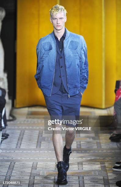 Model walks the runway during the Mihara Yasuhiro Ready to Wear Spring/Summer 2013 show as part of the Paris Men Fashion Week on June 29, 2012 in...