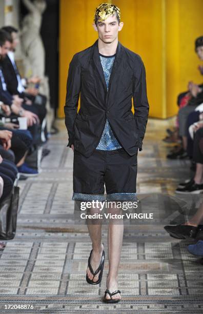 Model walks the runway during the Mihara Yasuhiro Ready to Wear Spring/Summer 2013 show as part of the Paris Men Fashion Week on June 29, 2012 in...