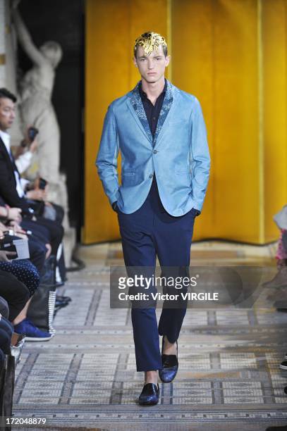 Model walks the runway during the Mihara Yasuhiro Ready to Wear Spring/Summer 2013 show as part of the Paris Men Fashion Week on June 29, 2012 in...