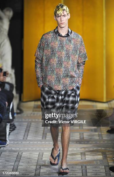 Model walks the runway during the Mihara Yasuhiro Ready to Wear Spring/Summer 2013 show as part of the Paris Men Fashion Week on June 29, 2012 in...