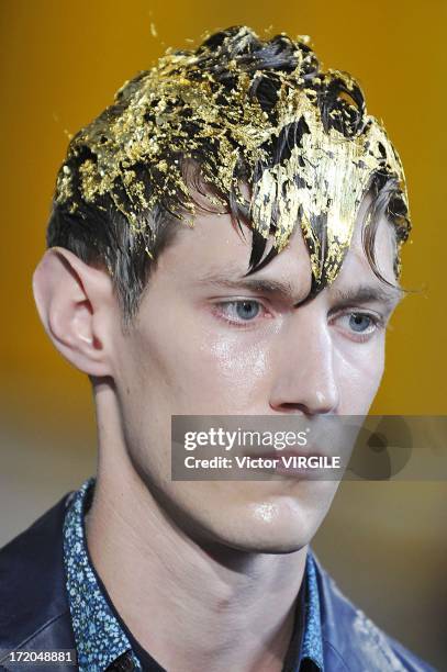 Model walks the runway during the Mihara Yasuhiro Ready to Wear Spring/Summer 2013 show as part of the Paris Men Fashion Week on June 29, 2012 in...